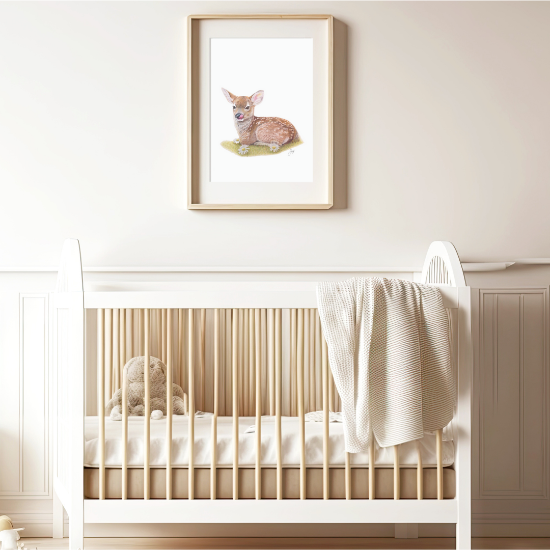 Framed Fawn print on a warmly lit nursery wall