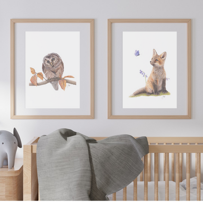 Framed prints of Woodland Owl and Woodland Fox on a nursery wall